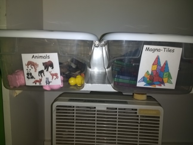 My son's smaller toys- on the left are animal figurines, and on the right magnetic construction tiles